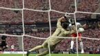 Poland's Robert Lewandowski scores a goal against Greece goalkeeper Costas Chalkias during the Euro 2012 soccer championship Group A match between Poland and Greece in Warsaw, Poland, Friday, June 8, 2012